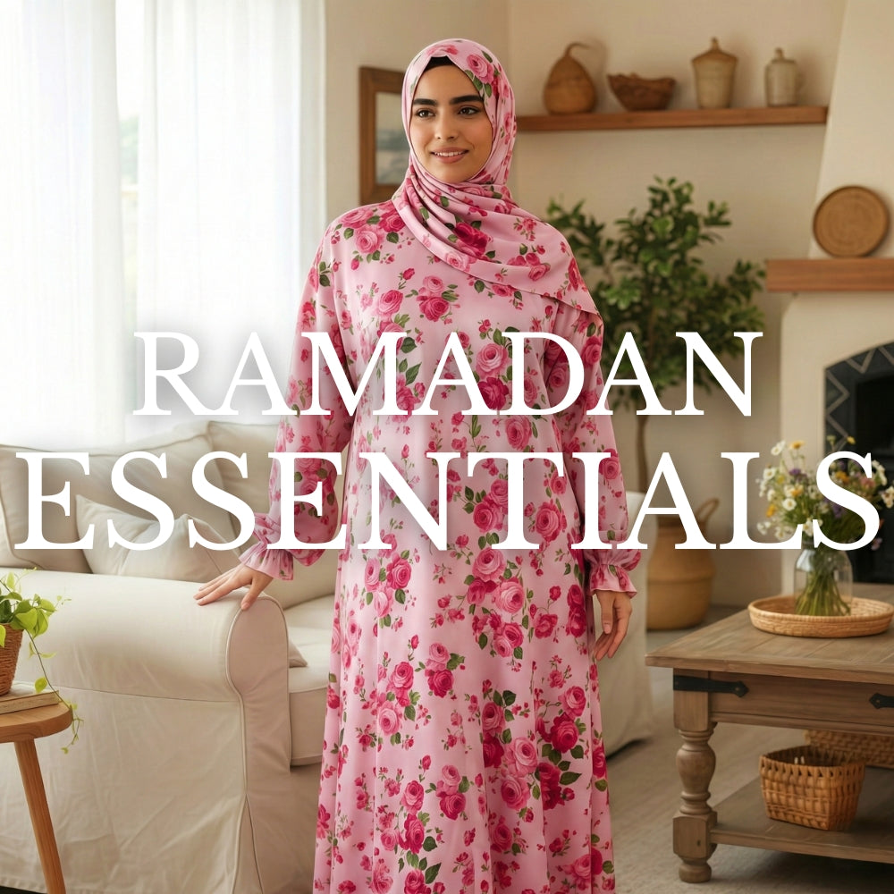 Close-up of pink floral fabric pouch with tassel on wooden surface, Ramadan essentials theme