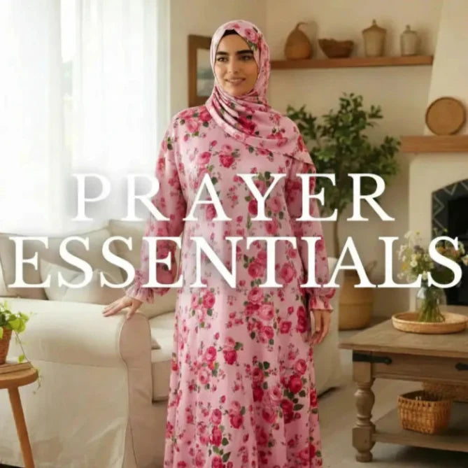 Woman wearing a pink floral hijab and dress in a living room setting with text 'PRAYER ESSENTIALS'.