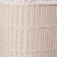 White woven wicker basket with lace fabric on top, showcasing intricate woven pattern