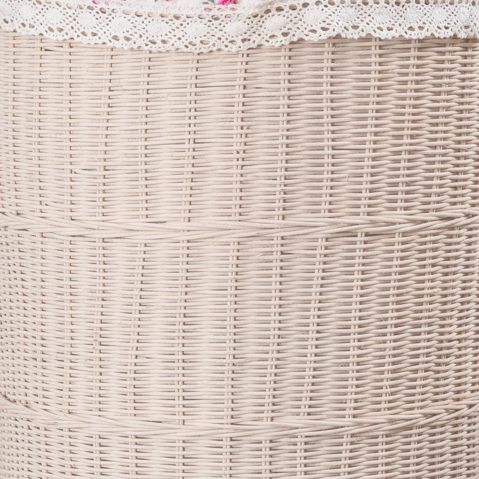 White woven wicker basket with lace fabric on top, showcasing intricate woven pattern