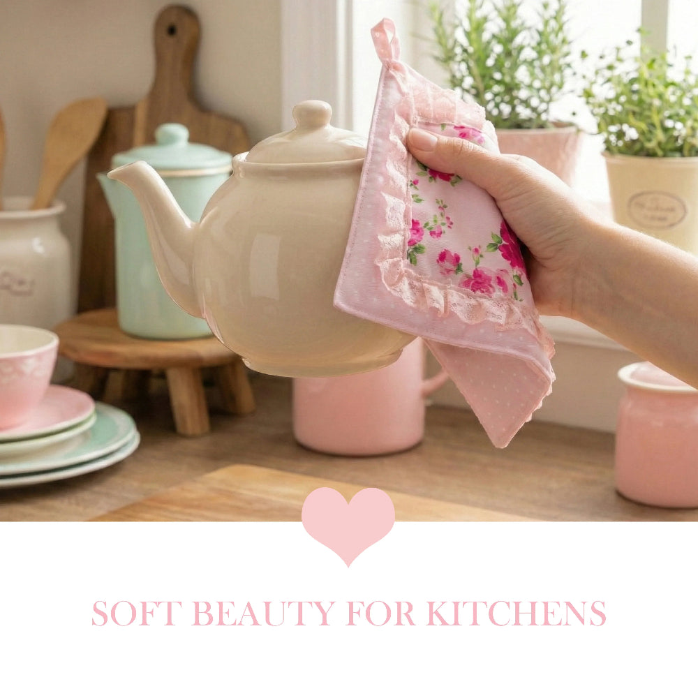 Hand holding a floral towel over a beige teapot on a kitchen counter with soft beauty theme.