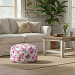 Floral ottoman in a cozy living room with a sofa, coffee table, and decorative elements.