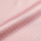 Pink fabric with small white polka dots