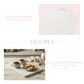 White cutting board with heart handle on pink background, accompanied by text about solid wood boards and country kitchen charm.