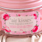 Close up of the pink floral label on an Air Kisses home fragrance soy wax melt jar.