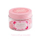 A clear jar with a pink lid containing Air Kisses home fragrance soy wax melts against a white background.