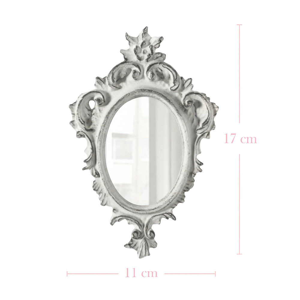 Ornate antique white oval mirror with distressed edges and floral carvings on a white background with dimensions.