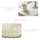 Woven coaster on a table with a cup of coffee, text describing rustic charm and handmade nature.