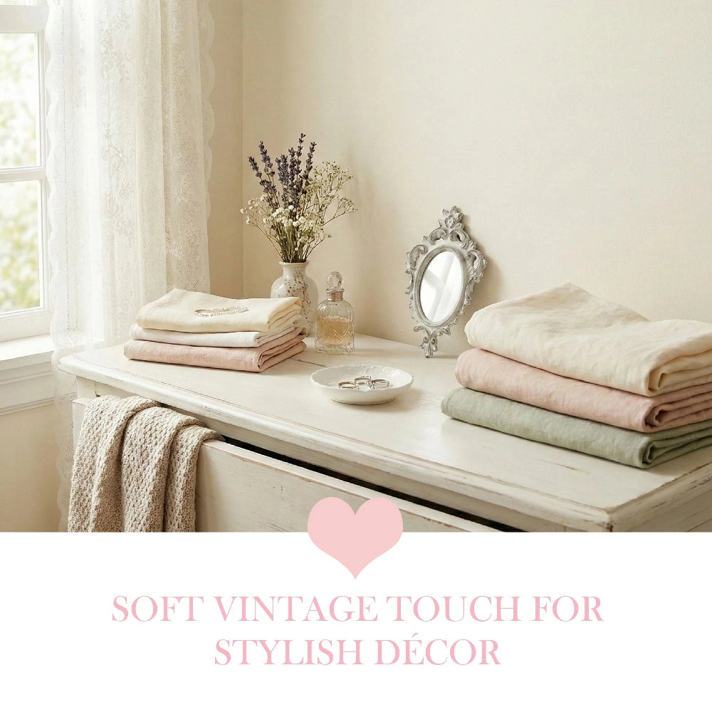 Antique White Pillar Candle stacks of folded towels on wooden surface with decorative items in home decor setting