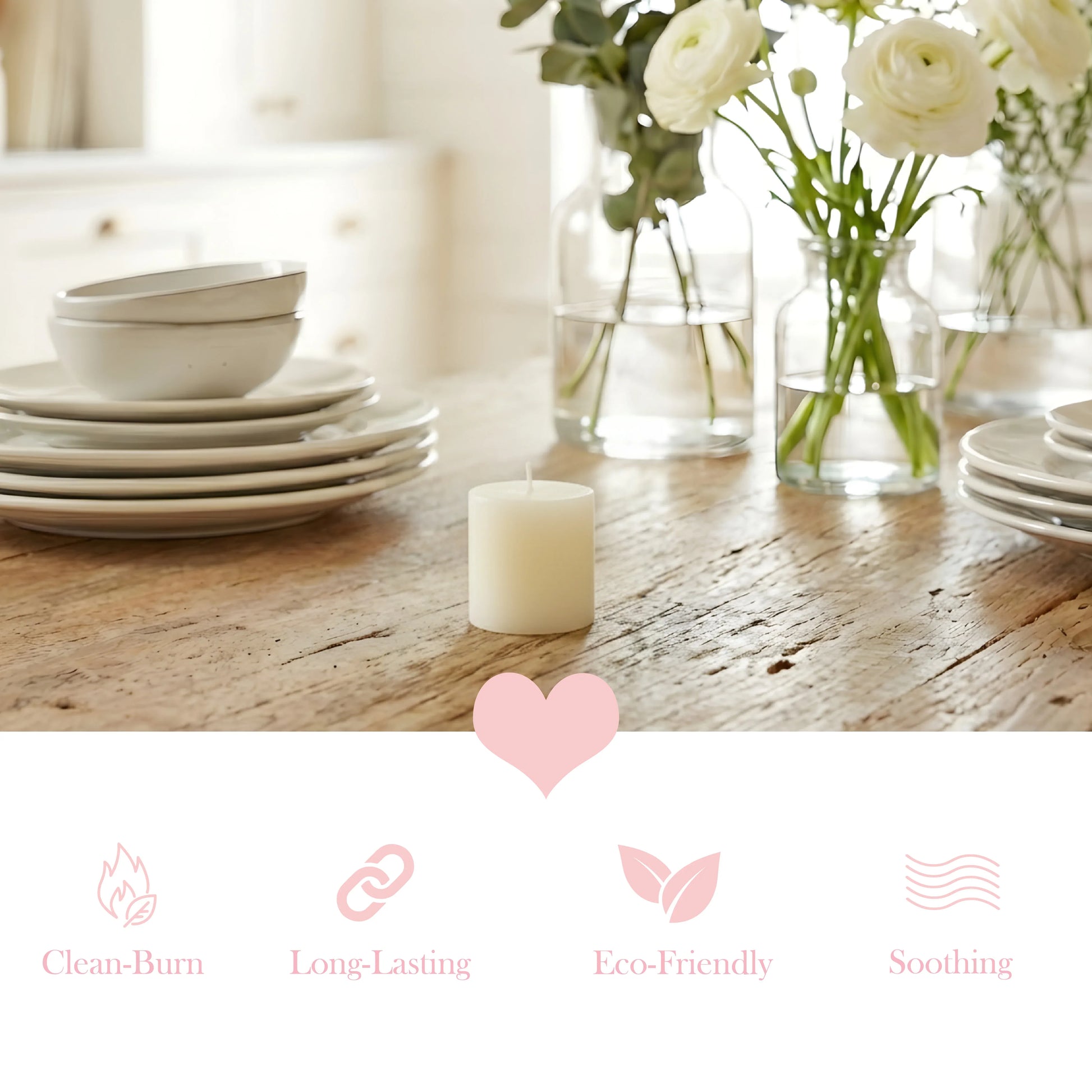 Candle on a wooden table with white plates and flowers in the background