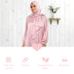 Woman wearing a pink hijab and dress against a white wooden background with text about fabric properties.
