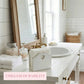 Bathroom vanity with sink, mirror, and decorative items with 'Timeless Durability' text.