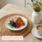Breakfast scene with croissant, berries, and coffee on a wooden table with 'Timeless Durability' text.