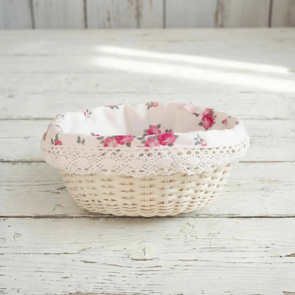 Cottage Round Wicker Basket with floral fabric lining on a wooden surface