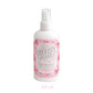 Bottle of Country Charm air freshener with a pink label on a white background
