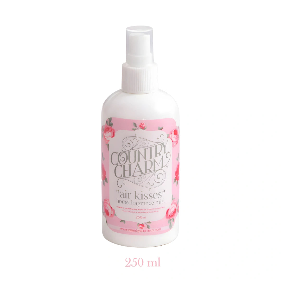 Country Charm Air Kisses Home Fragrance bottle with pink label displayed on white background