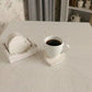 Country Charm Heart-Shaped Coasters with Wooden Holder beside white mug with drink on textured surface home decor scene