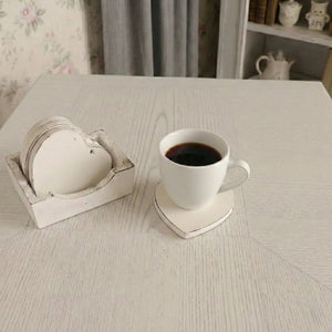 Country Charm Heart-Shaped Coasters with Wooden Holder beside white mug with drink on textured surface home decor scene