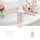 Bottle of Country Charm spray on a vanity with makeup and flowers