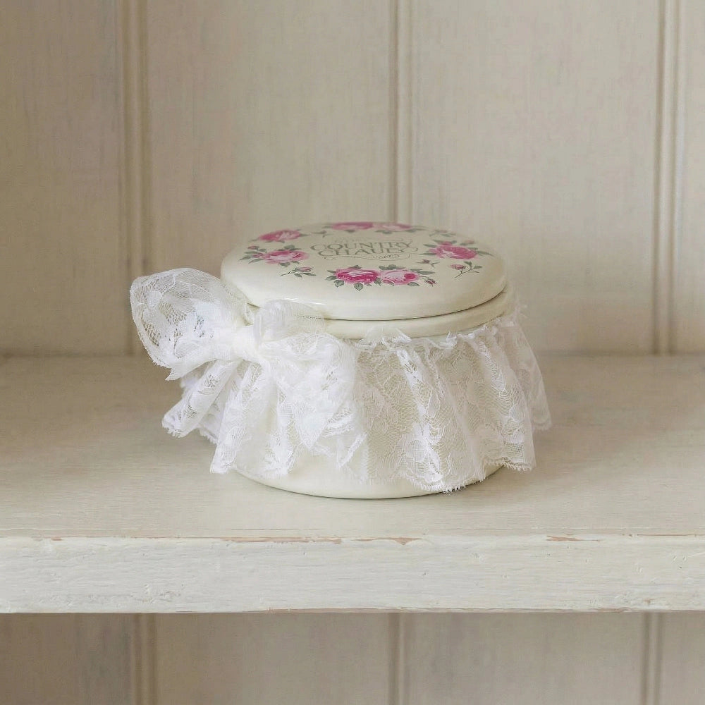 Rosie Tin Jar with floral lid, lace ribbon, displayed on wooden shelf for Eid treats storage