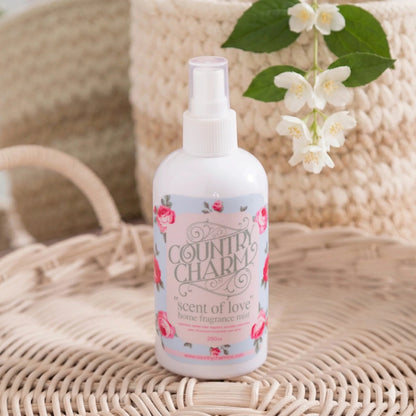Country Charm Scent of Love Home Fragrance mist bottle with floral design on woven surface