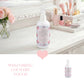 Bottle of Country Charm spray on a vanity with makeup and flowers