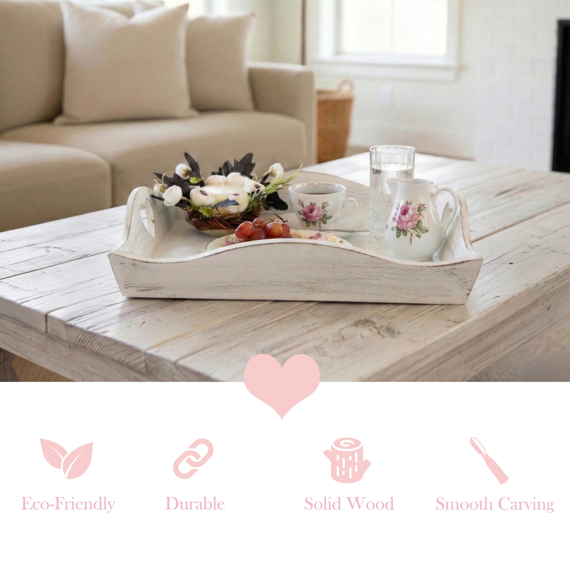 Antique white wooden tray with decorative items on a coffee table in a living room.