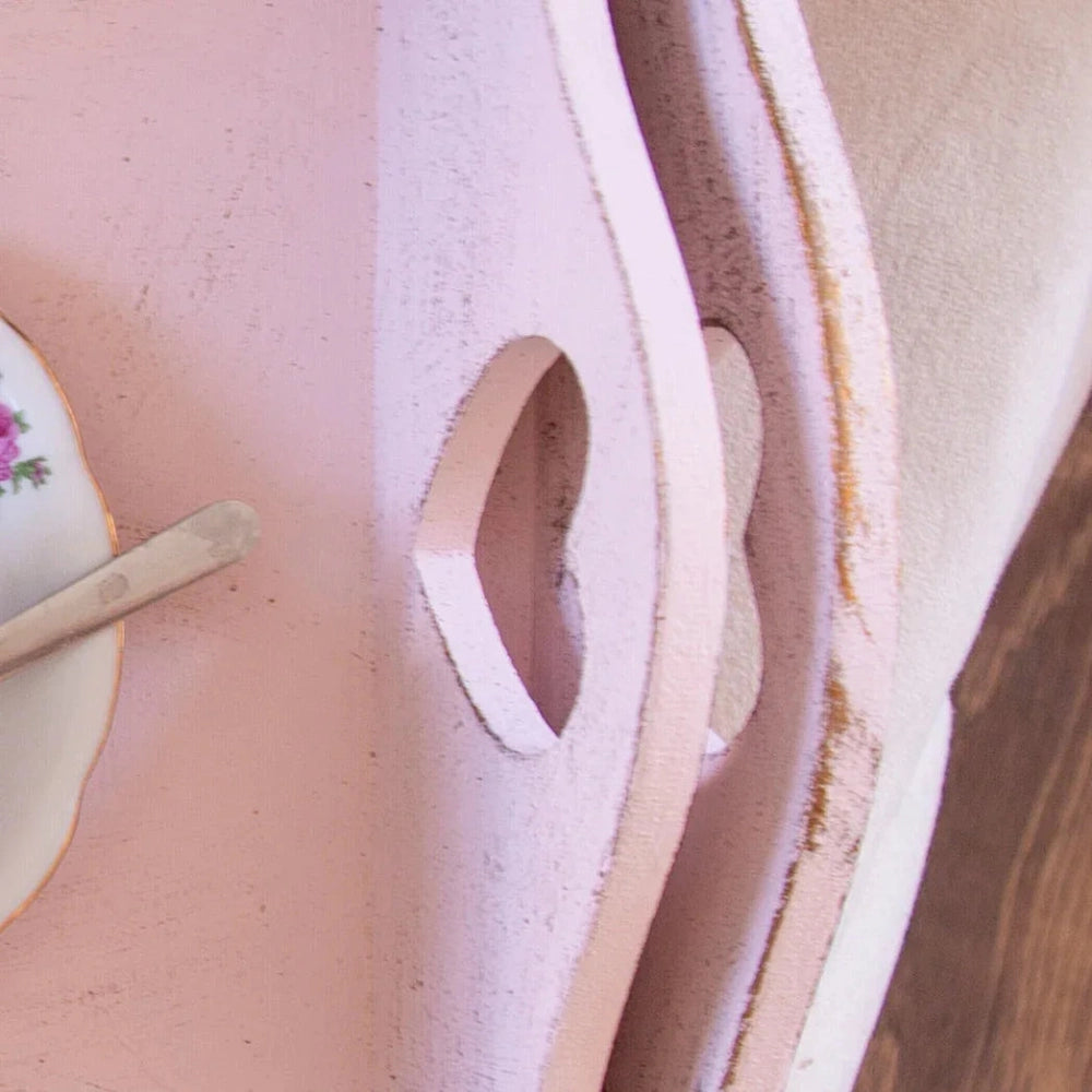 Country Heart Cut-Out Tray with floral teacup on pink surface close-up