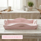 Pink ceramic tray on a wooden table with a blurred kitchen background