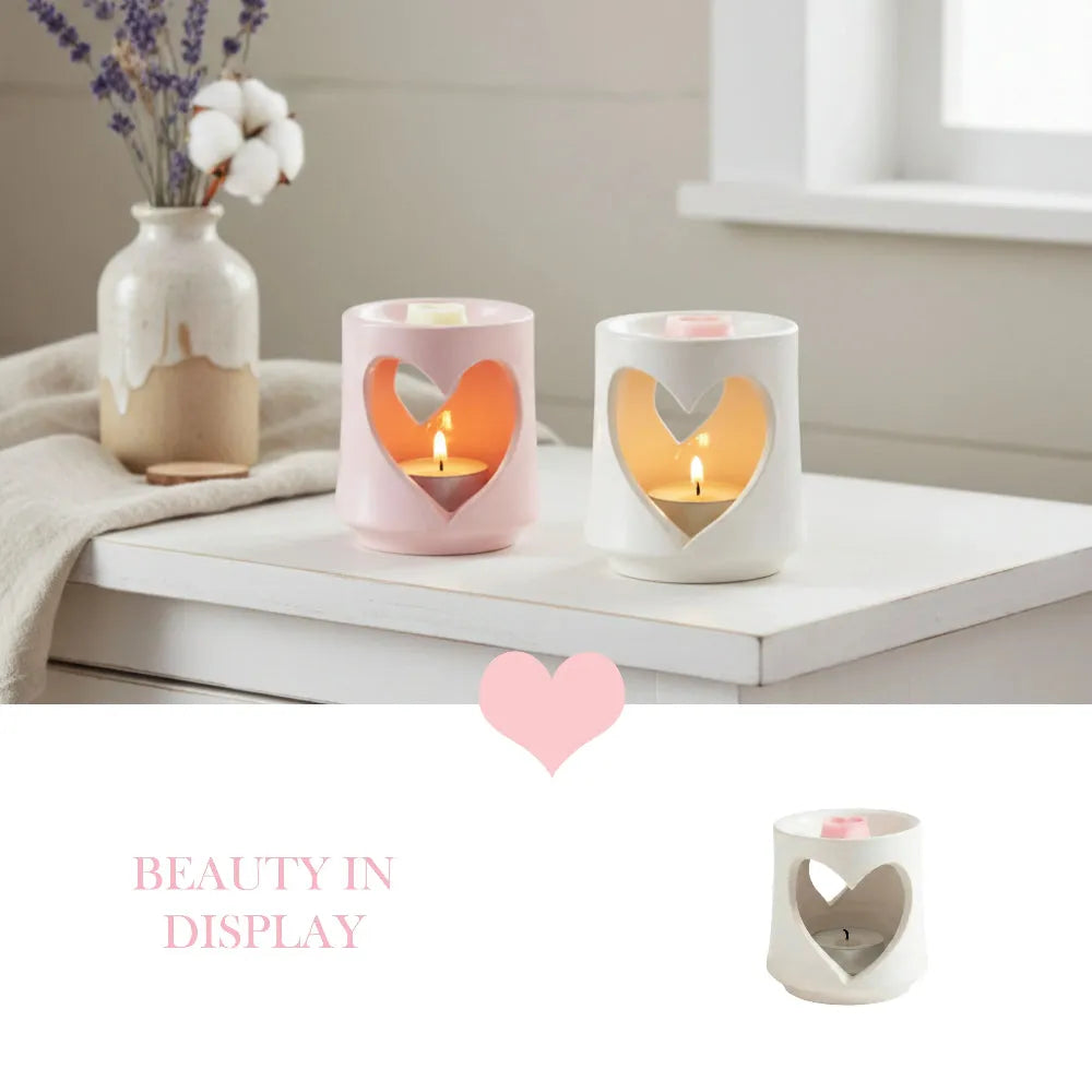 Country Heart Cut-Out Wax Melter heart-shaped holders with lit candles and floral decor on white surface