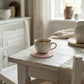 Cup of coffee on a wooden table with a cozy, homey atmosphere
