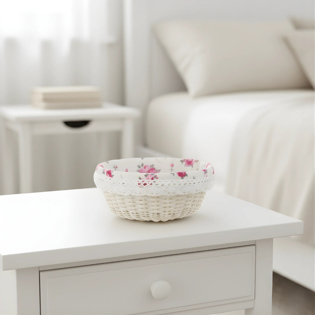 Decorative Cottage Round Wicker Basket with floral pattern on a white wooden table in a living room.