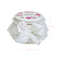 Decorative jar with floral lid and lace details, featuring measurements on a white background.