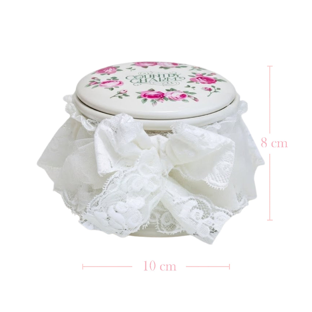 Decorative jar with floral lid and lace details, featuring measurements on a white background.