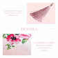 Decorative tassels and fabric with floral design on a pink background