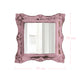 Square pink mirror with distressed ornate edges and pink dimension lines indicating 10 cm height and width.