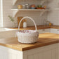 Wicker basket with floral lining on a kitchen counter