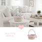 Wicker basket with floral accents on a white table in a bright living room.