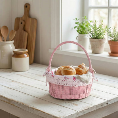 Pink wicker basket with bread on a wooden table in a bright kitchen.