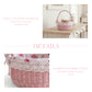 Pink wicker basket with floral fabric on a wooden table, with text describing its features.