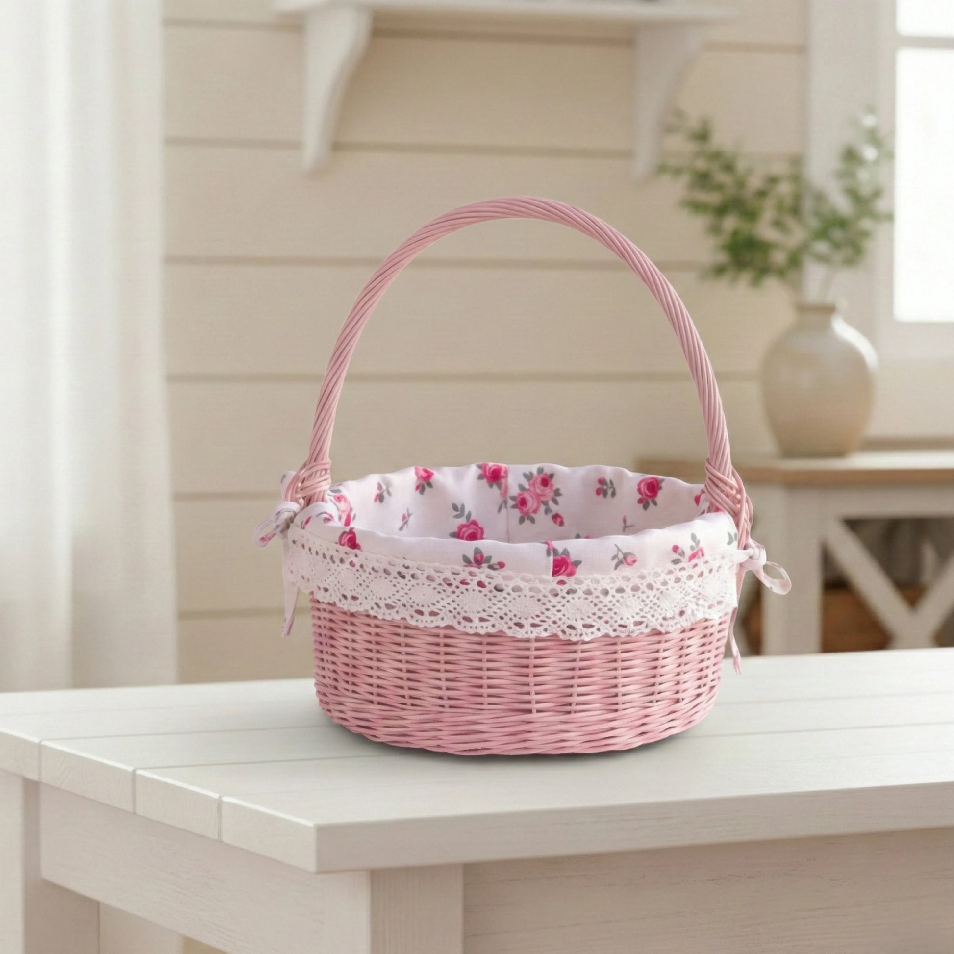Pink wicker basket with floral lining on a white table