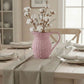 Farmhouse Wicker Jug Pale Pink with cotton branches on dining table