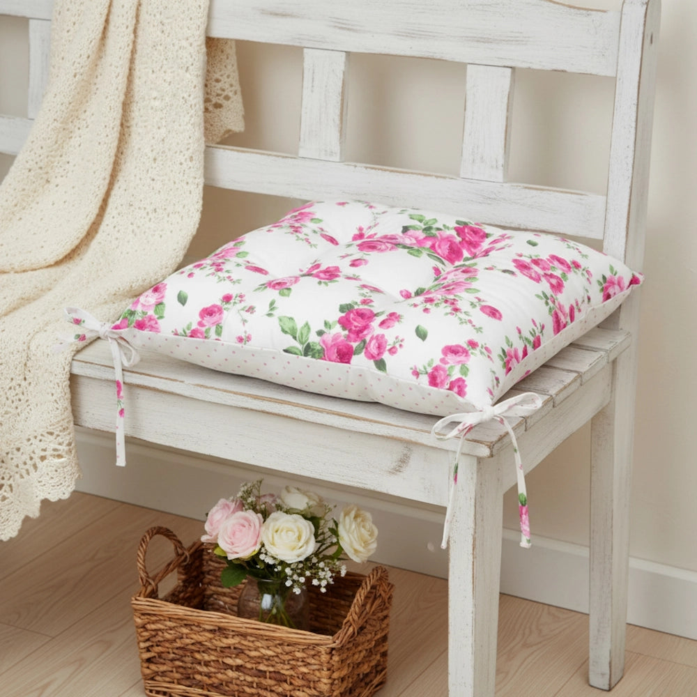 Fleur Chair Cushion floral design placed on wooden bench with basket of flowers