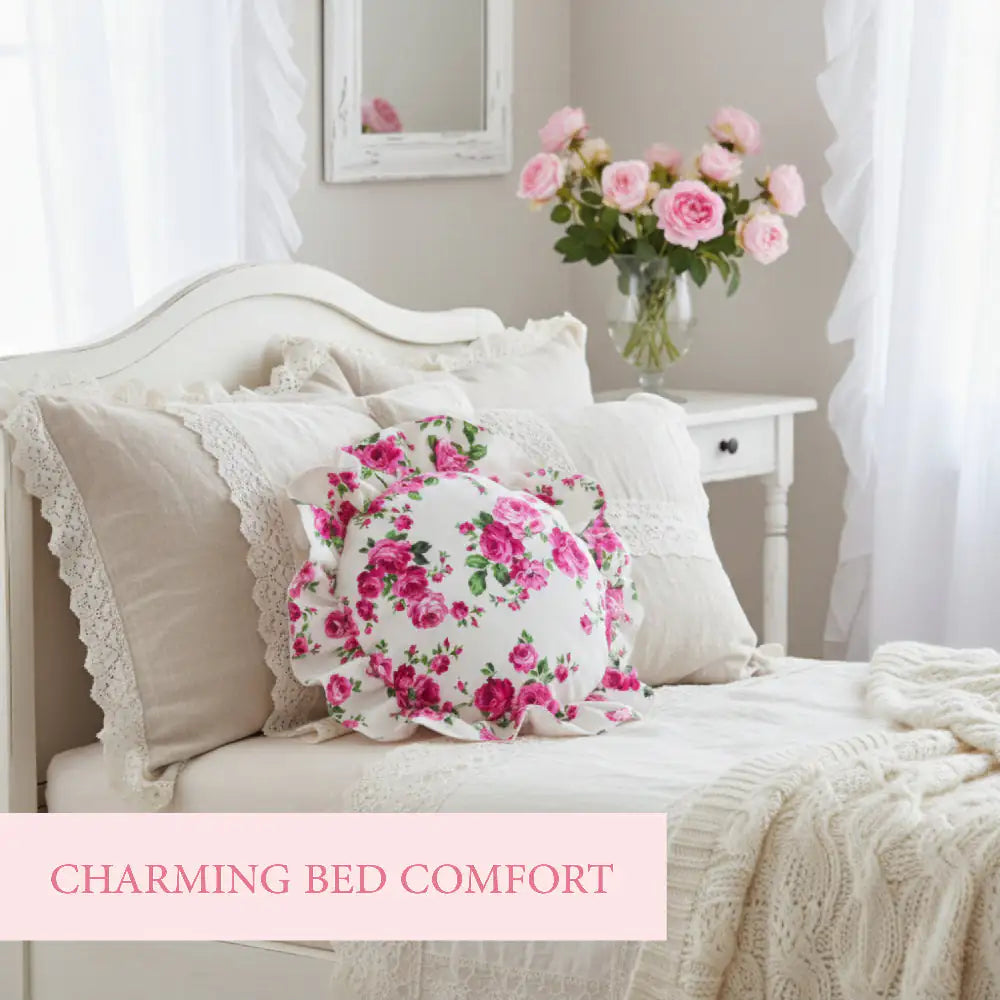 Antique white circular floral pillow with ruffled edge on a bed
