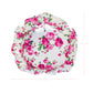 Antique white floral patterned circular pillow with ruffled edges with measurement on a white background
