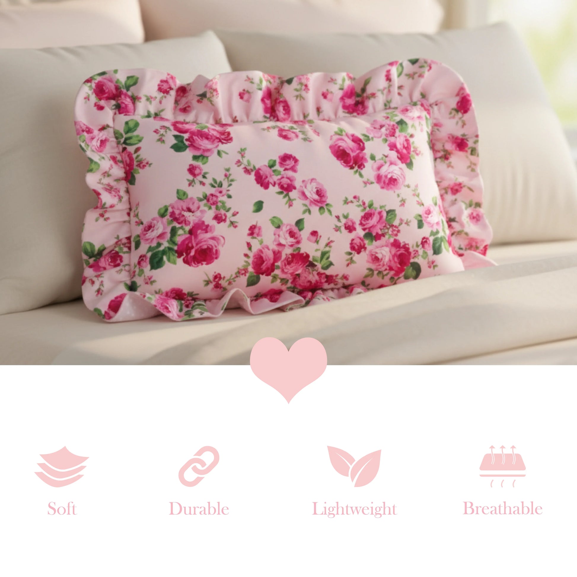 Pale pink rectangular floral pillow on a beige sofa with decorative elements and text icons.