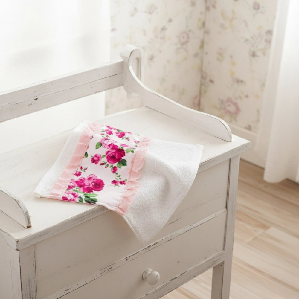 Fleur Face Towel with floral pattern displayed on white wooden table