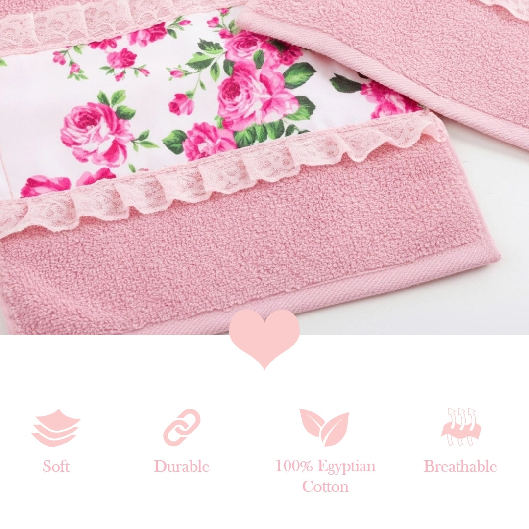 A pink face towel with a floral fleur print and lace detailing, with product details and logo