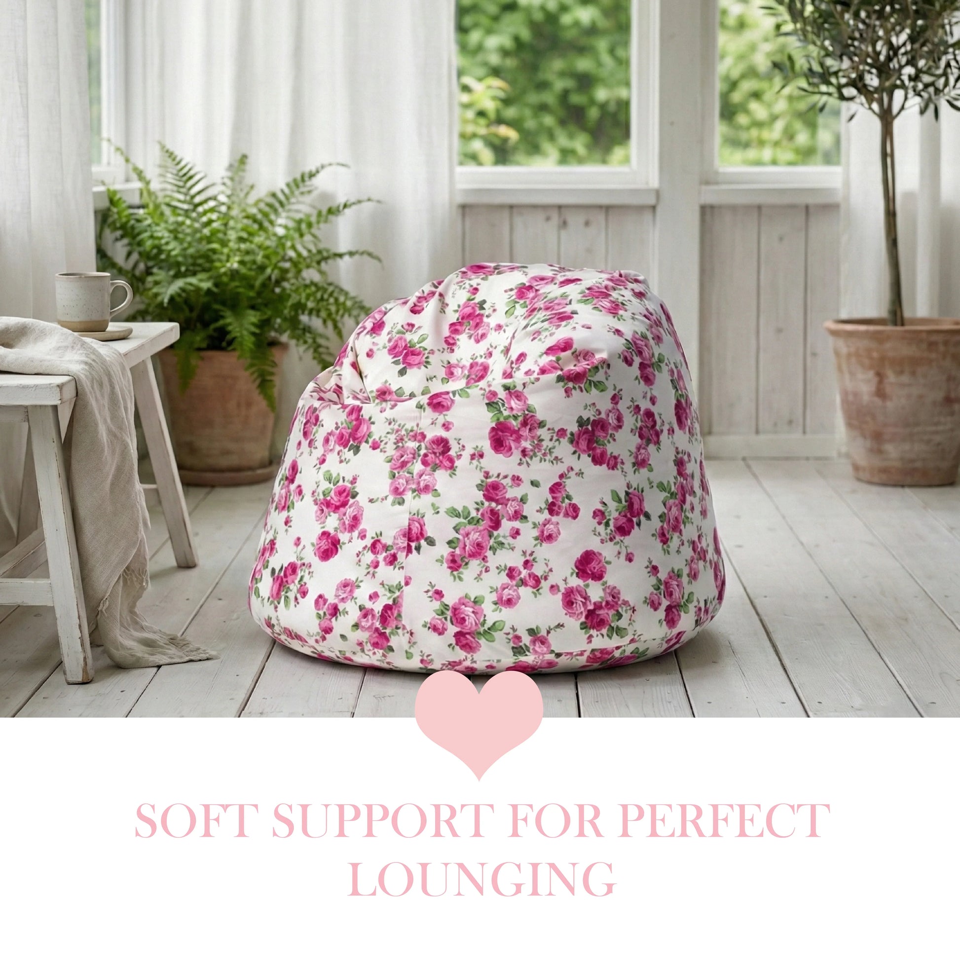 Floral bean bag chair in a room with plants and a window.

