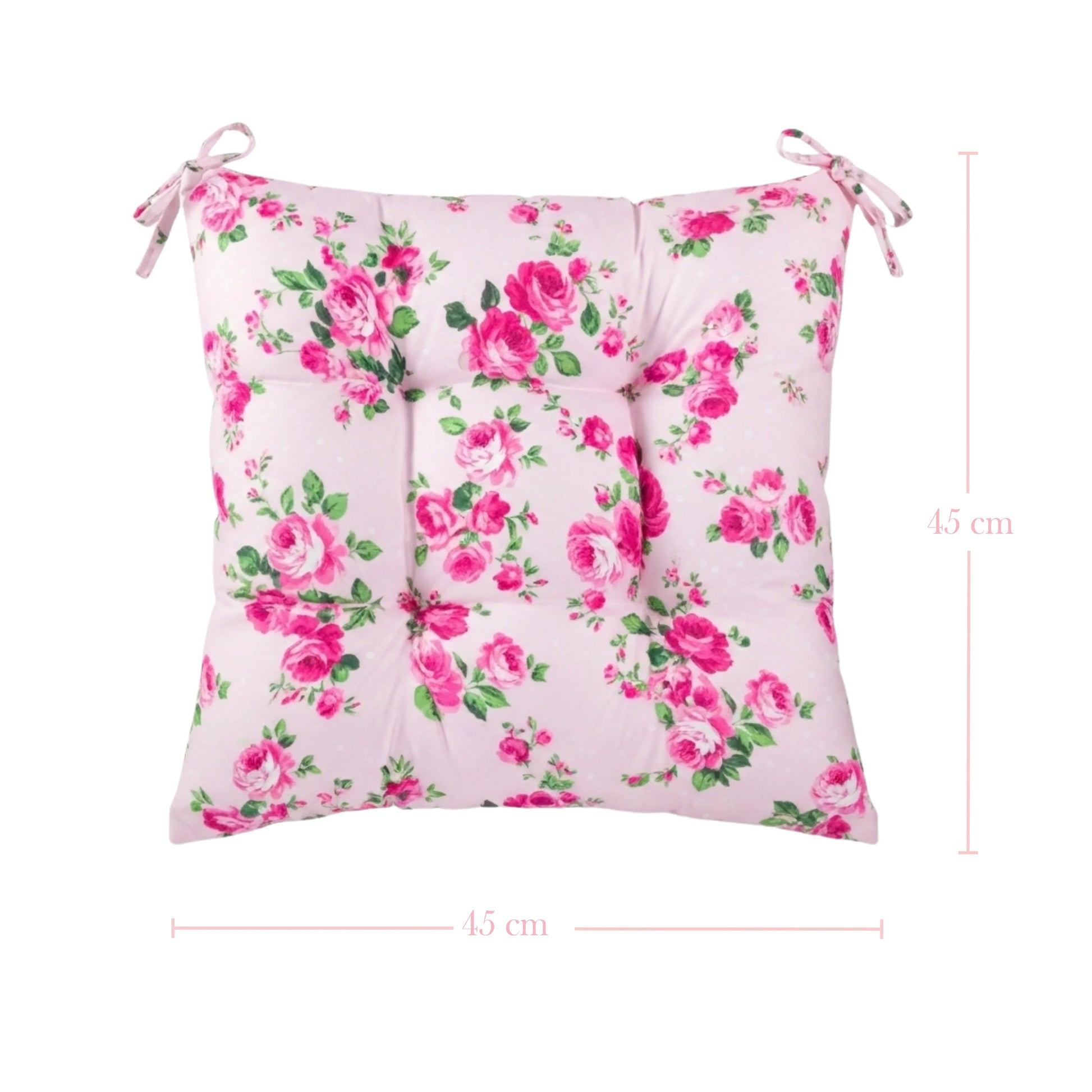 Floral-patterned cushion with pink roses on a white background